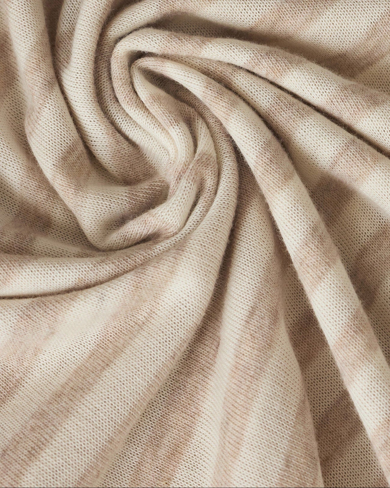 Close-up of beige fabric with folds
