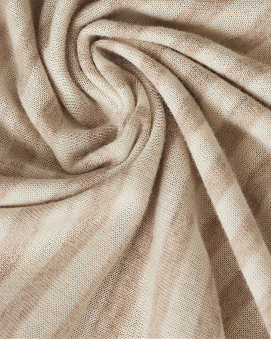 Close-up of beige fabric with folds