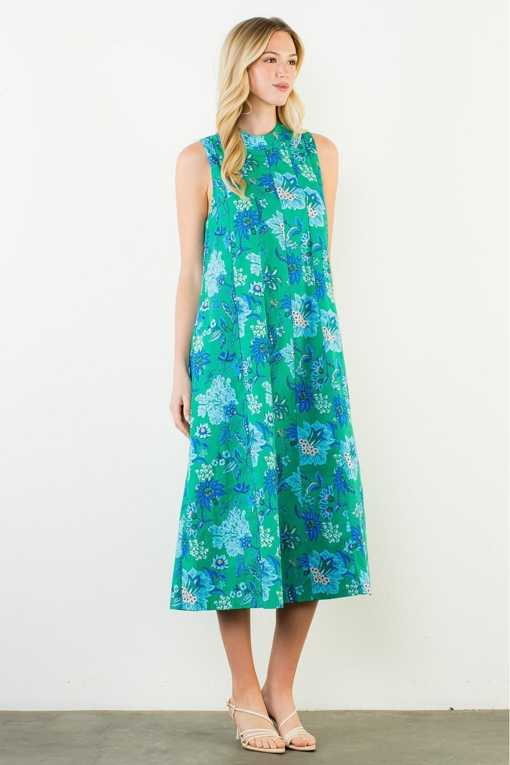 Woman wearing a floral dress on a white background