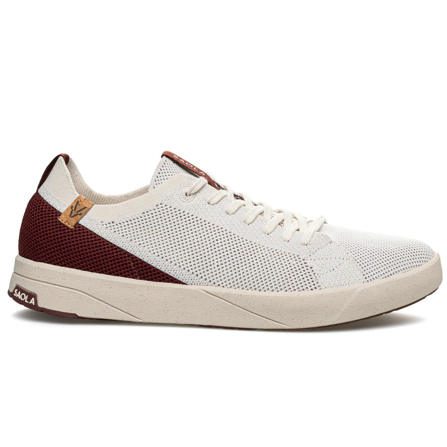 White sneaker with maroon accents on a white background