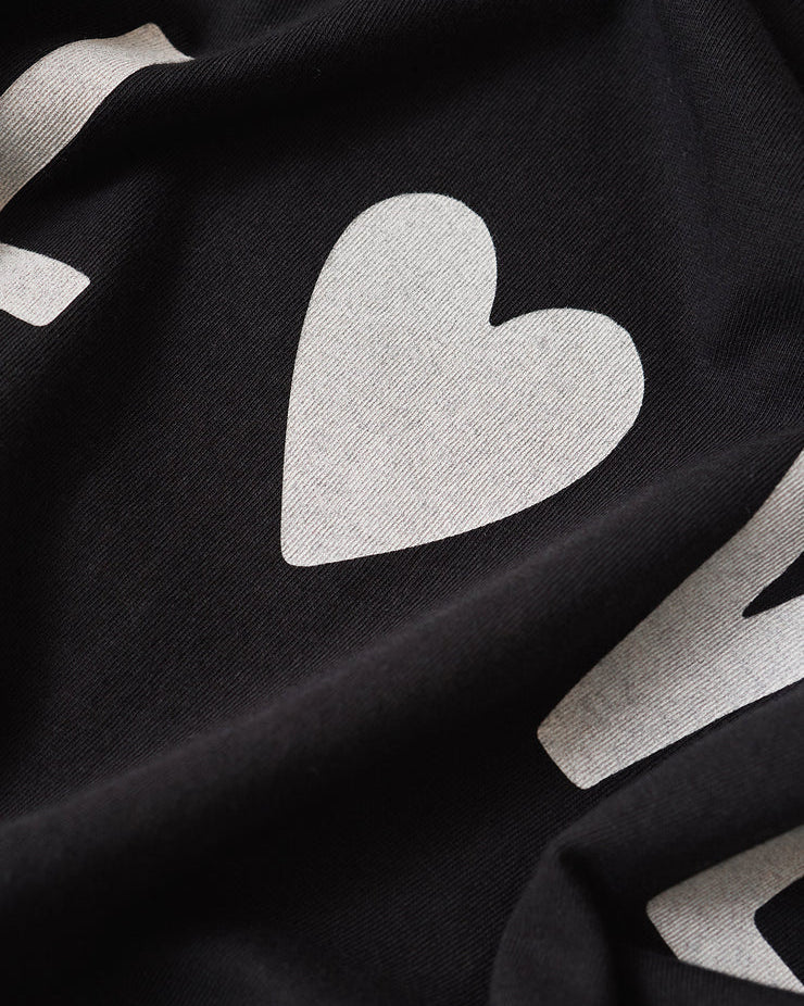 Black fabric with white heart shapes