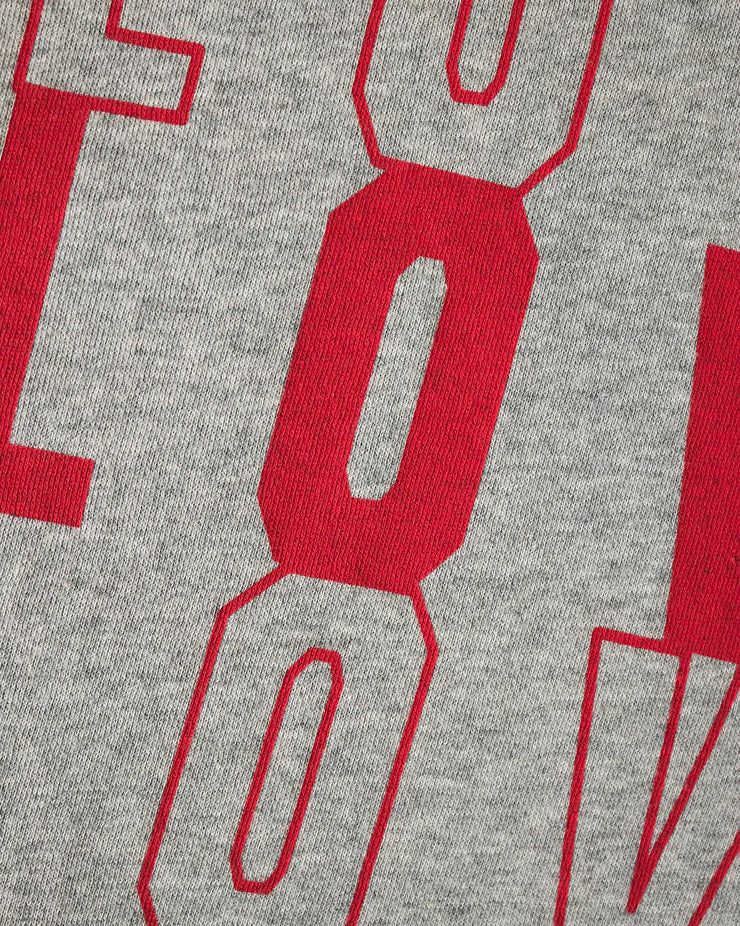 Gray fabric with red text and shapes