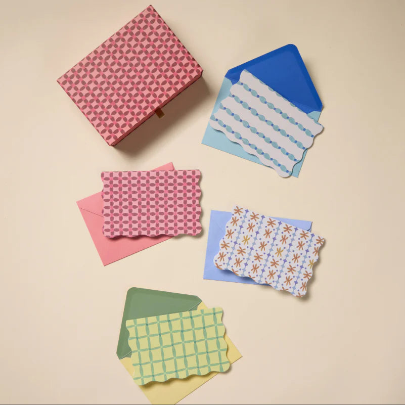 Colorful folded paper on a beige background