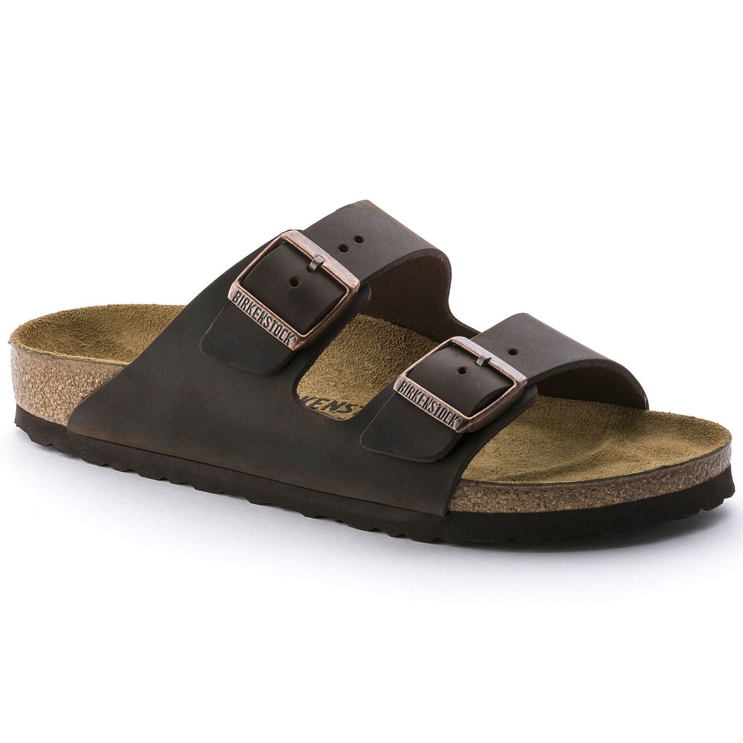 A person standing on one foot wearing Birkenstock Arizona Leather Narrow sandals in black color.