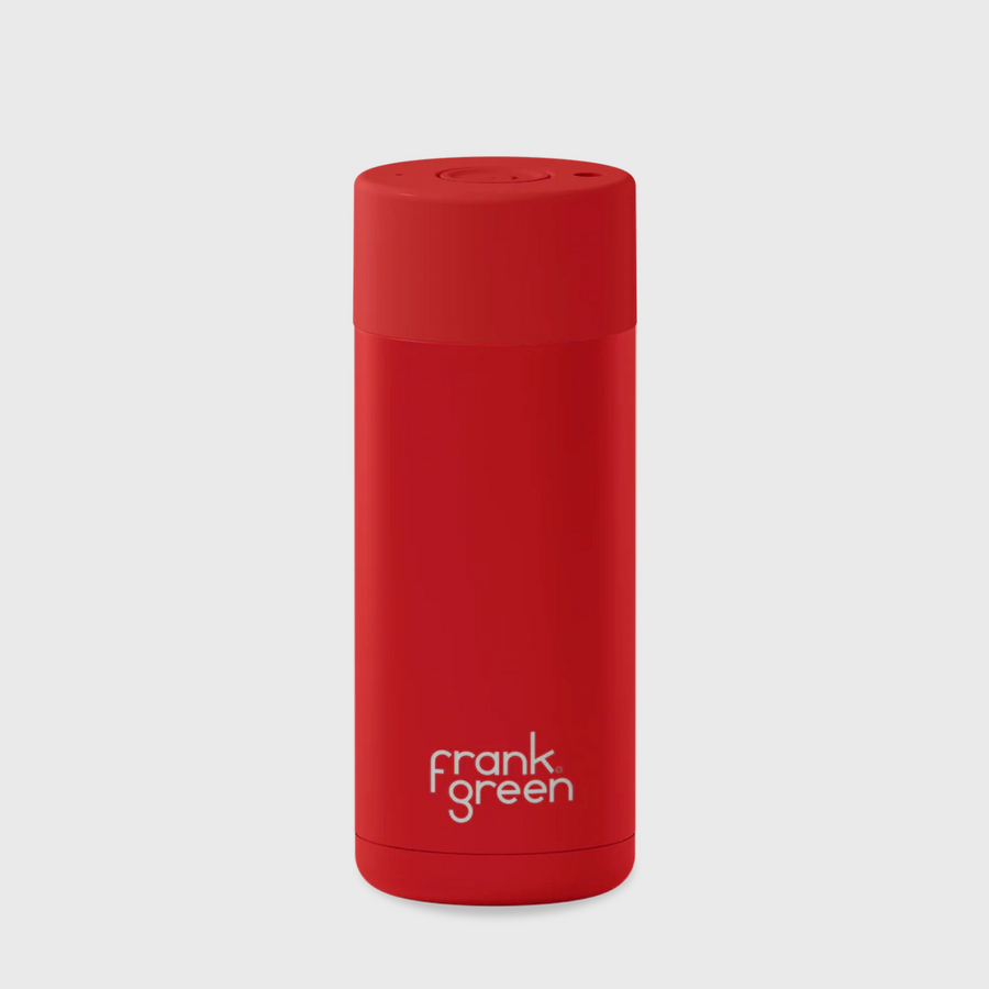 A ceramic reusable cup with the frank green brand logo on the side.